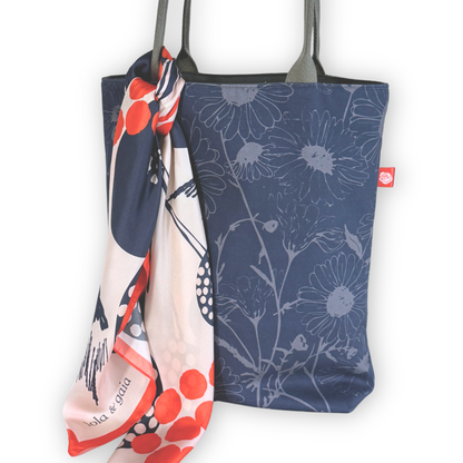 Gaia Shoulder Carry Tote in Wild Daisy, Twilight, closeup view styled with a silk scarf