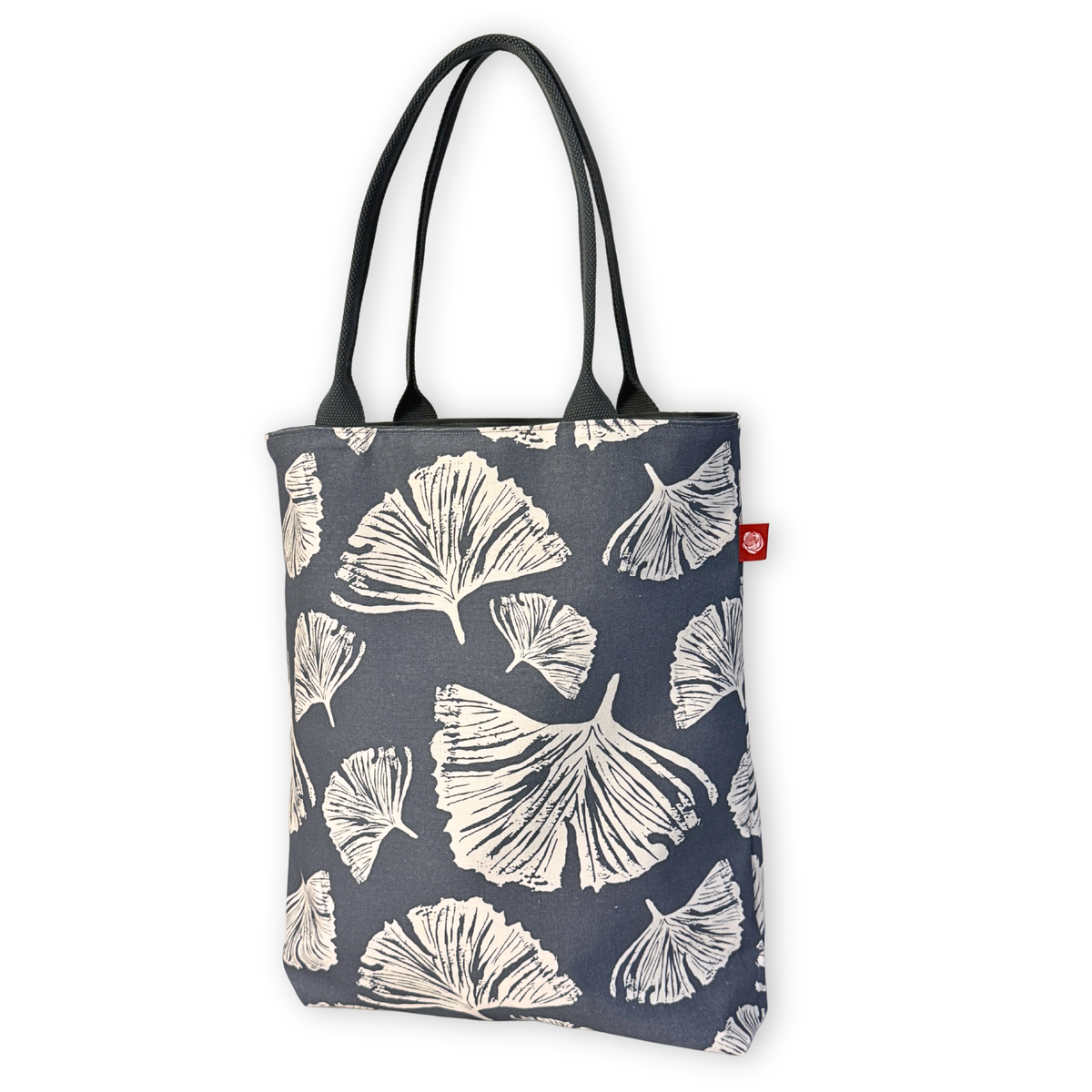 Gaia Shoulder Carry Tote in Ginkgo Poppy, sitting upright showing full print