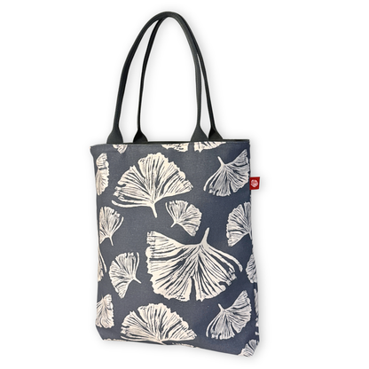 Gaia Shoulder Carry Tote in Ginkgo Poppy, sitting upright showing full print