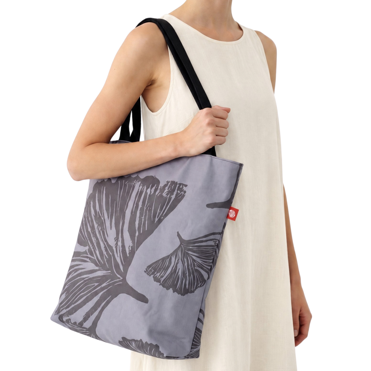 Gaia Shoulder Carry Tote in Evening Ginkgo, model carrying tote on shoulder