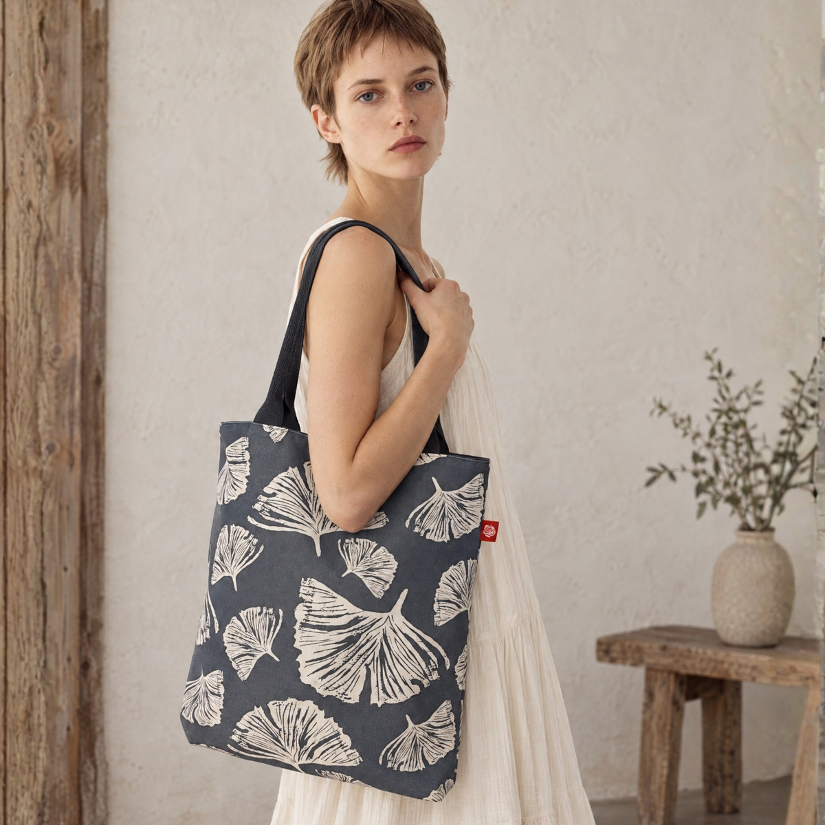 Gaia Shoulder Carry Tote in Ginkgo Poppy, model carrying tote on shoulder