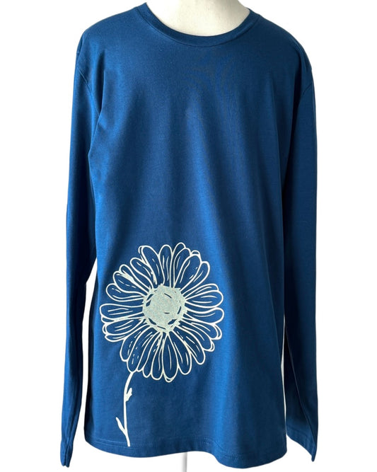 "Daisies long sleeve tee made from organic cotton, featuring a floral design for casual wear."
"Lightweight and breathable long sleeve t-shirt with daisy motifs, ideal for everyday style."
"Nature-inspired long sleeve shirt featuring a delicate daisy print on soft cotton."
"Organic cotton long sleeve tee with a floral daisy design, perfect for layering."
"Casual and comfortable long sleeve shirt with botanical daisy patterns."
