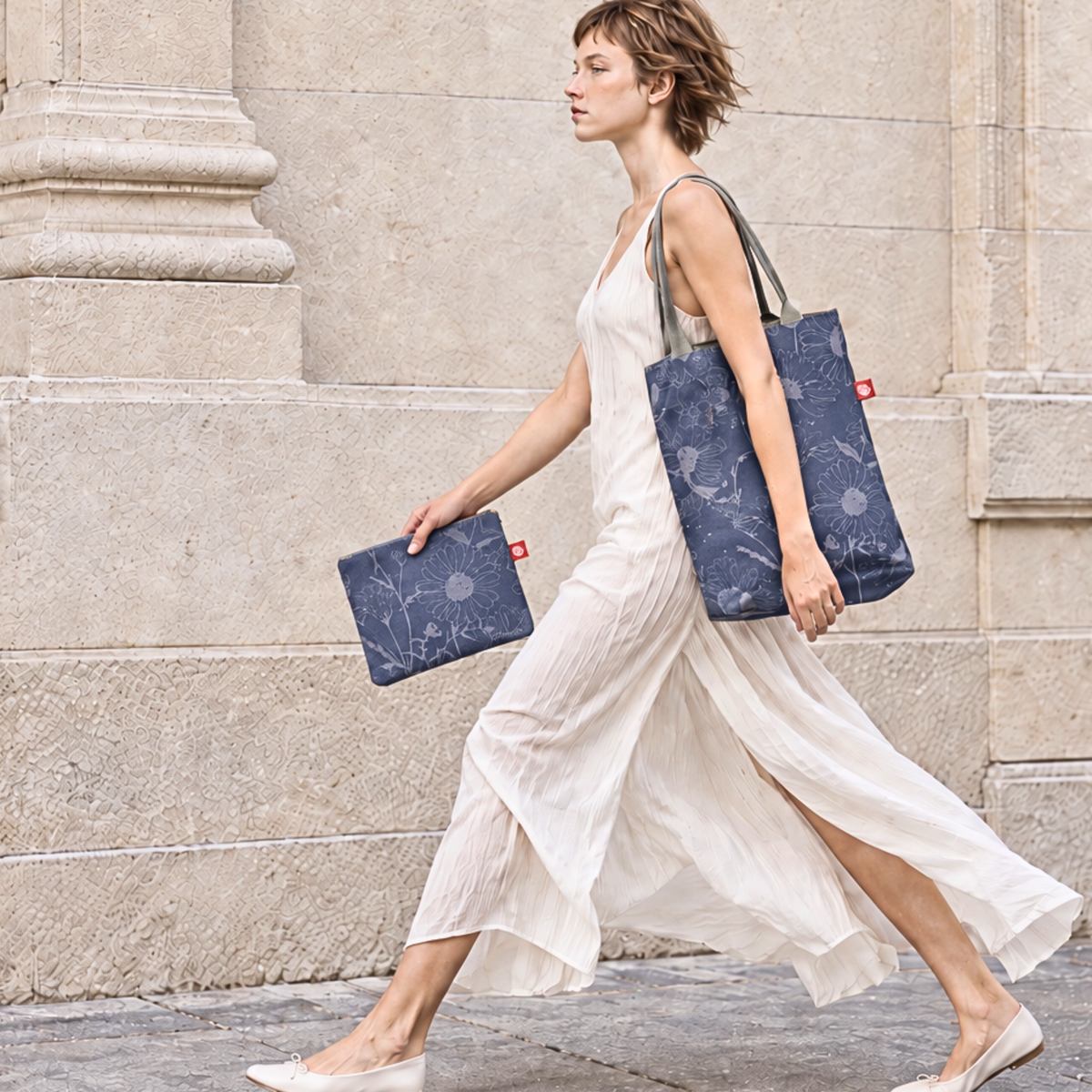 Gaia Shoulder Carry Set in Wild Daisy, Twilight, woman carrying the set and walking down a street